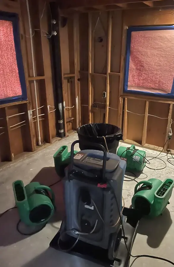 Water spreading across a floor from a burst pipe in a Riverton, NJ home